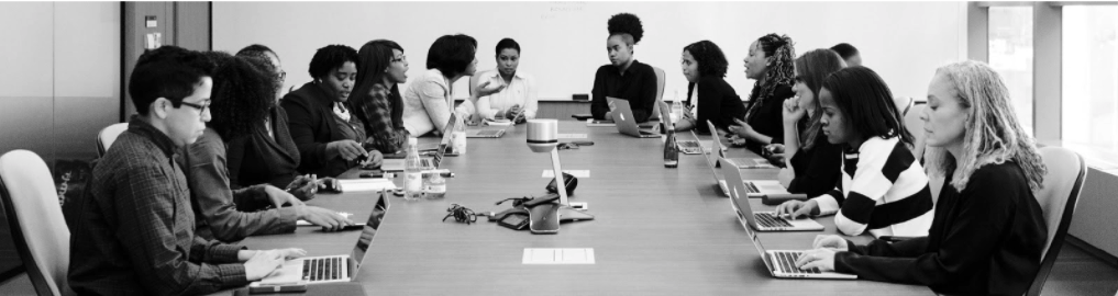 People working around a conference table